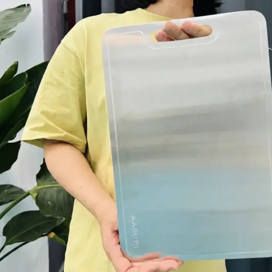 Sara holding her Kasuri cutting board